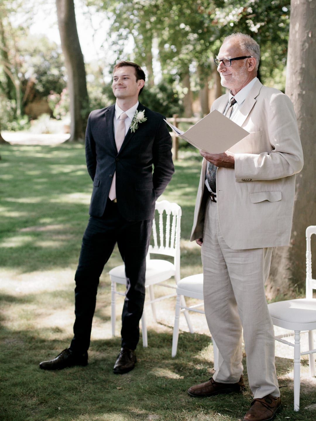 Dan in his wedding suit and the priest